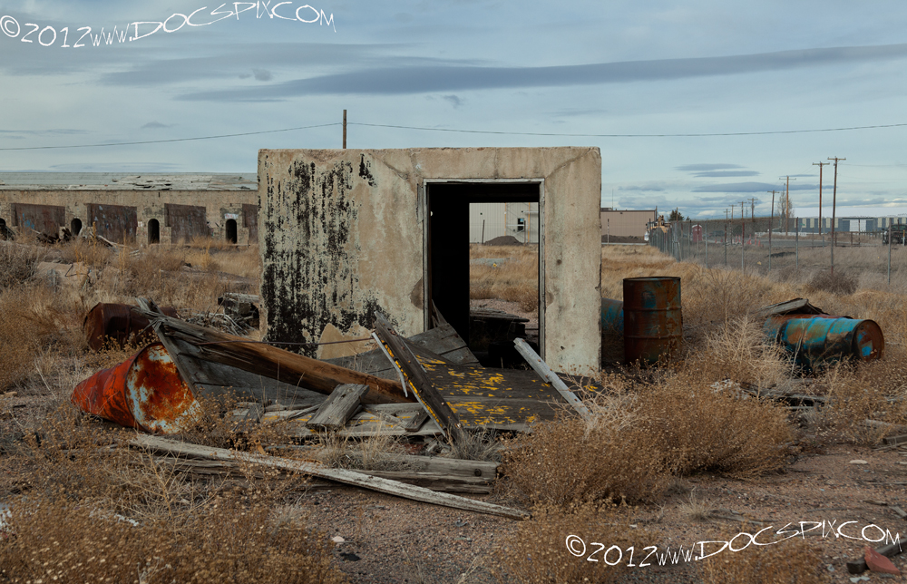 Telegraph office, looking north. Debris in foreground are 1920's flat truck beds. 