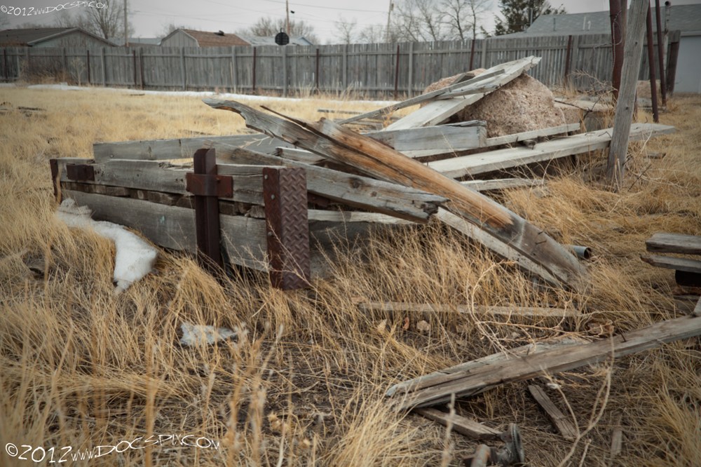 An old truck bed sits along the western perimeter of the site.