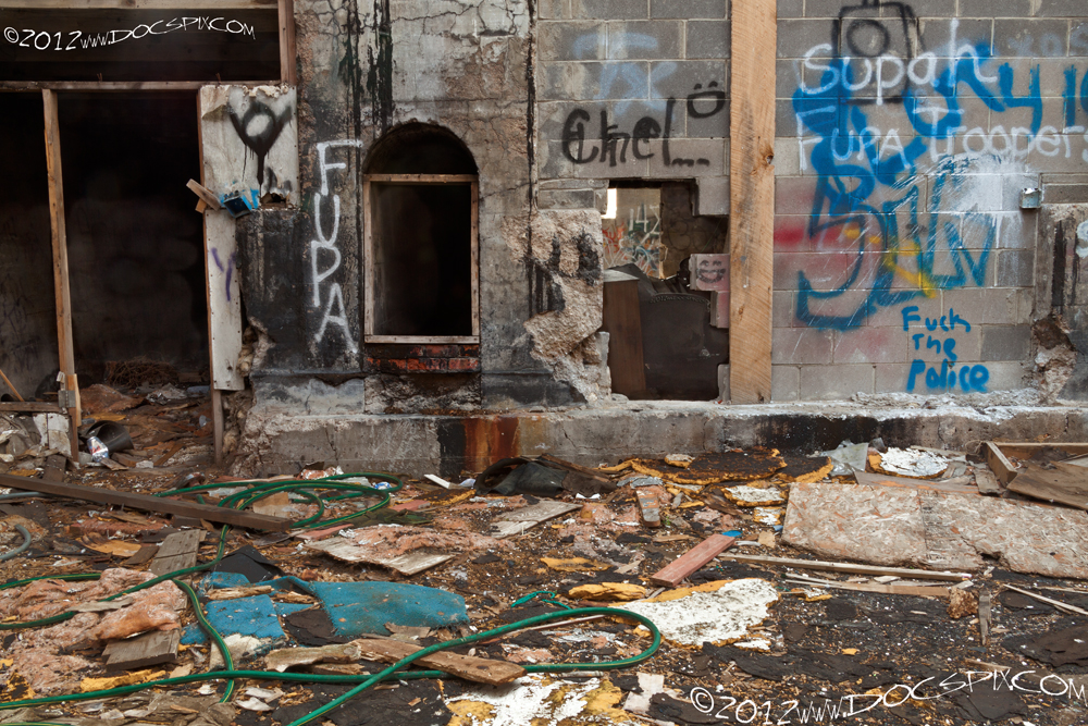 The opening in the center leads to the elevator shaft. The furnace on the left is sealed on the south side of the factory. 