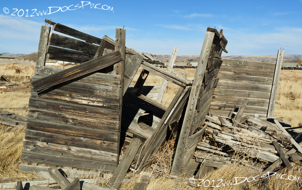 An outhouse stands alone near the eastern end of the stills.