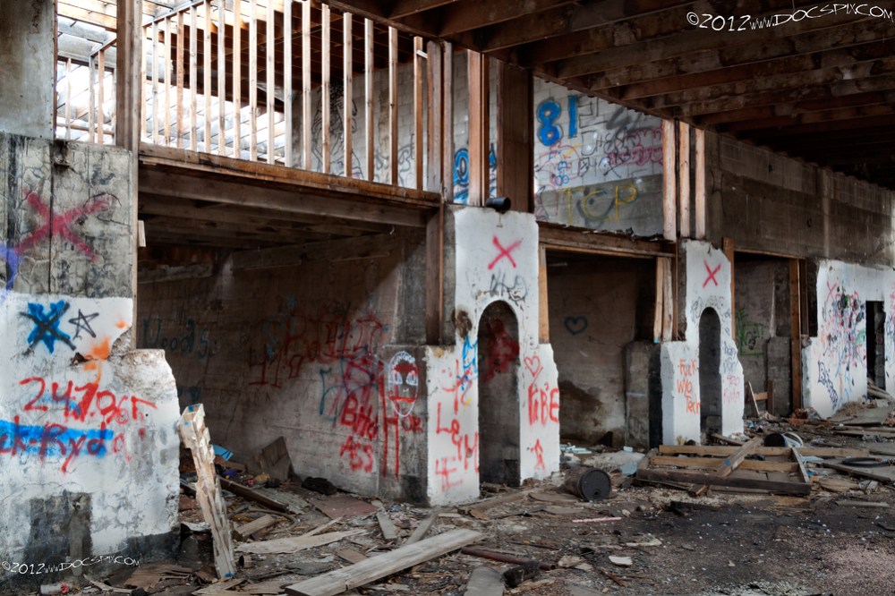 Another view of the south factory floor. The archways in the still bases are open through to the north side of the factory. These were originally used as furnaces for oil refinement. 