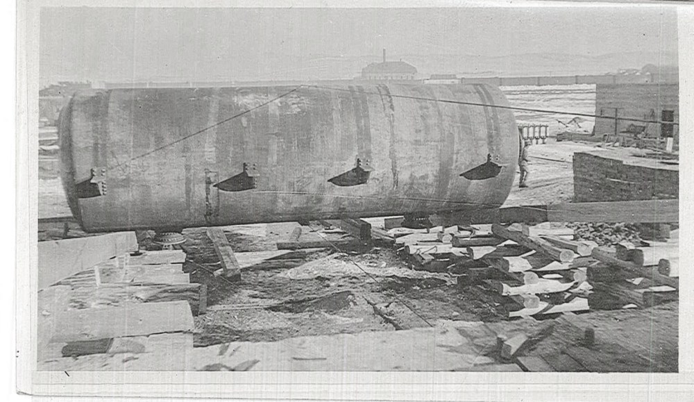 One of the still tanks is being rolled up the top of the foundations. 