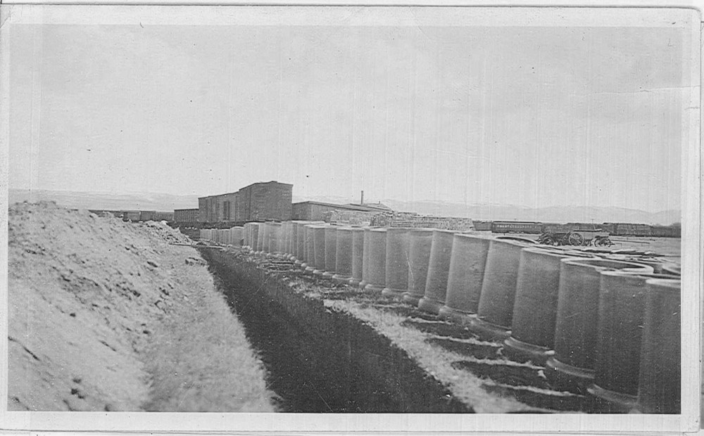 Pipes line a trench near the eastern edge of the refinery property. 