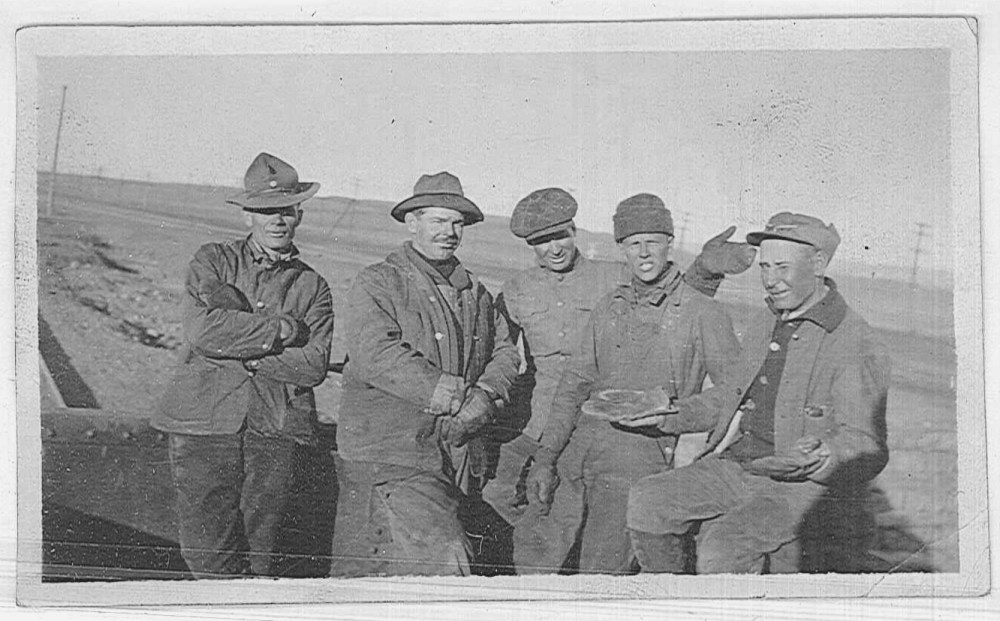 Unidentified workers taking a moment to pose for the camera. 